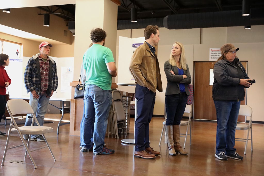 Josh Hawley And His Wife Erin Wait To Vote Photos Columbiamissourian Com josh hawley and his wife erin wait to