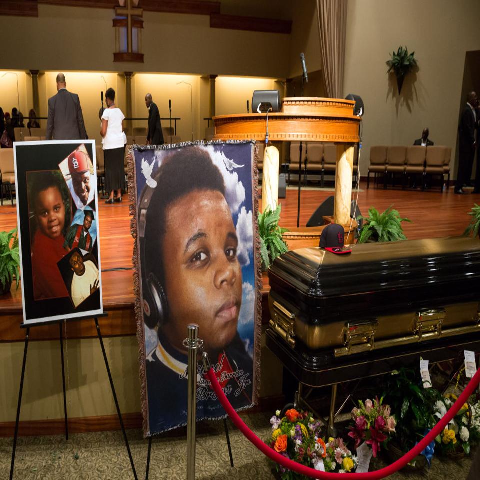 Mourners file past the casket of former St. Louis Cardinals great