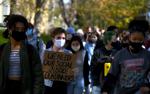 Students walk in a protest