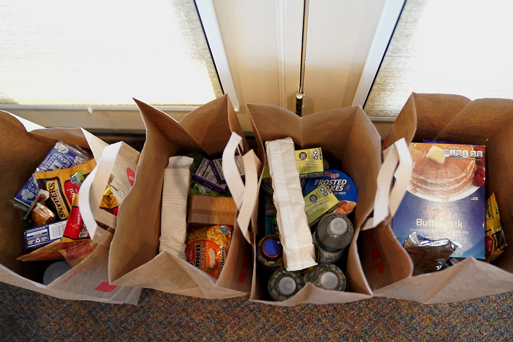 Supplies are packed in bags by Beulah Ralph Outreach Committee members according to the needs of different families