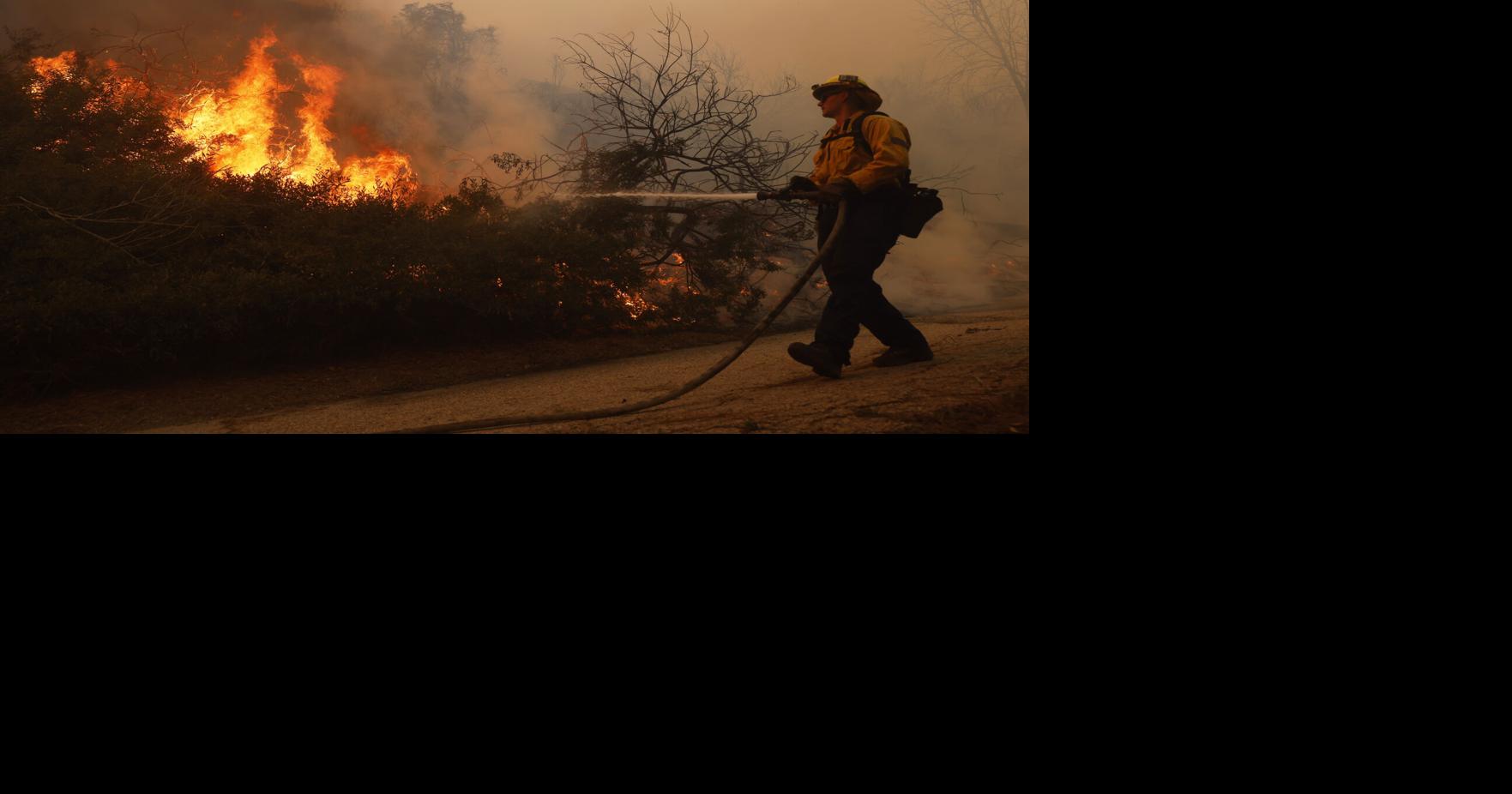 Thousands of Los Angeles residents flee as winds stoke a fast-moving ...