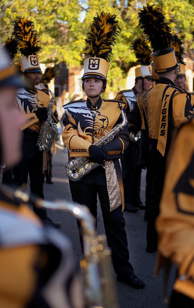 Keisha Rush waits for the start of the homecoming parade while sporting the new Marching Mizzou uniforms