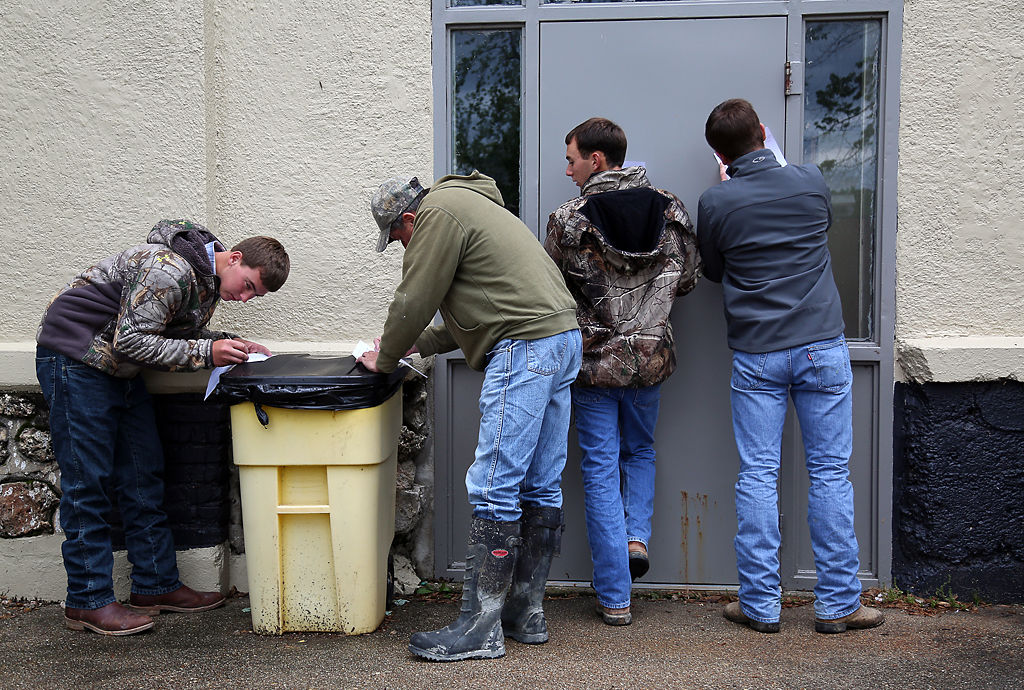 People complete volunteer waivers