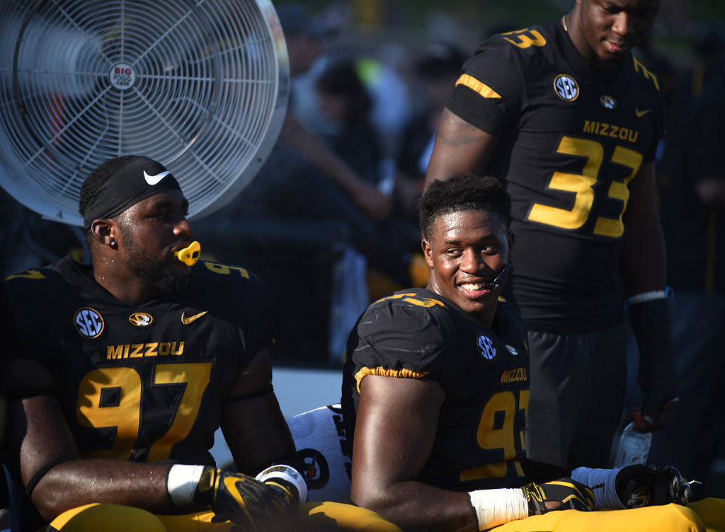 Missouri defensive lineman Tre Williams smiles on the bench next