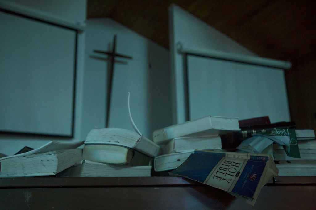 Bibles, hymn books and other religious texts rest on the piano