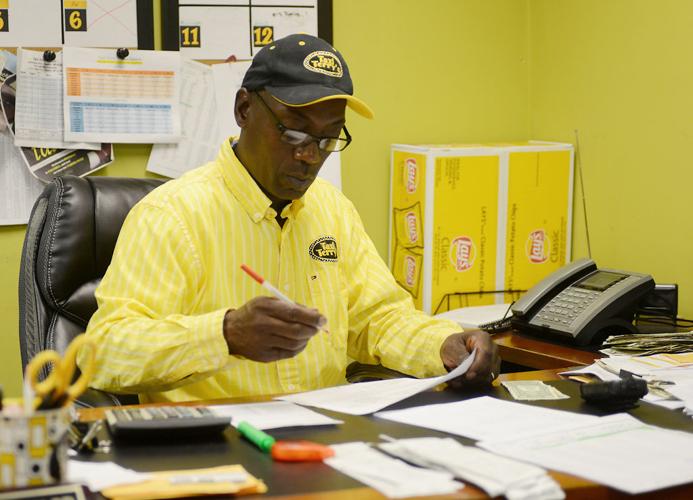 Terry Nickerson Sr. coordinates pickups and drop-offs from his office