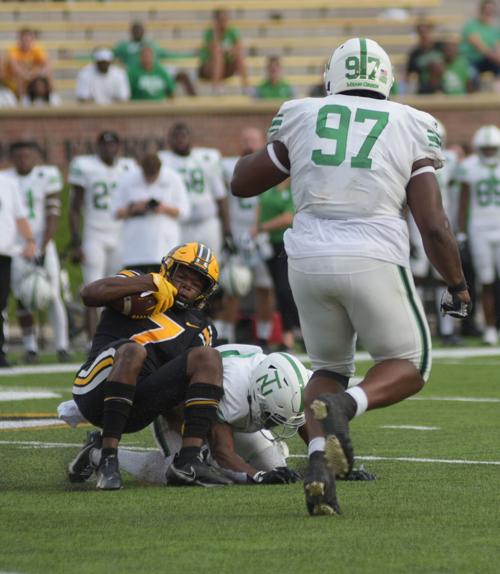 Dominic Lovett gets tackled by John David Jr.