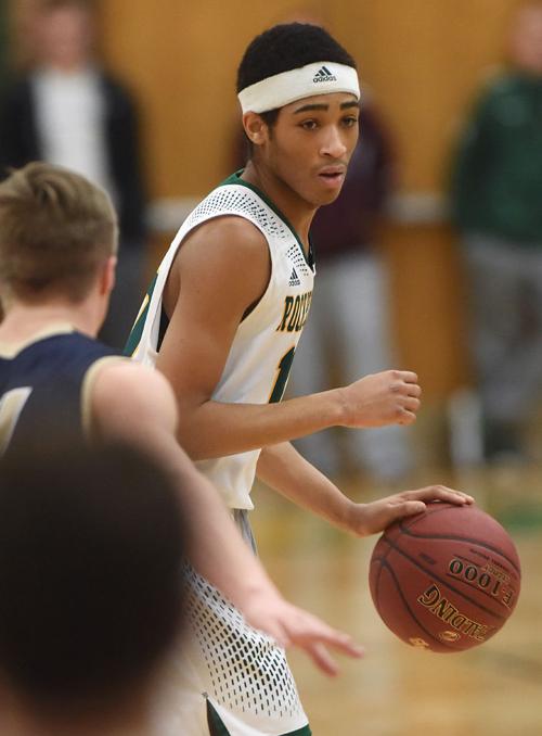 Dajuan Harris Dribbles The Ball As He Looks For A Teammate To Pass