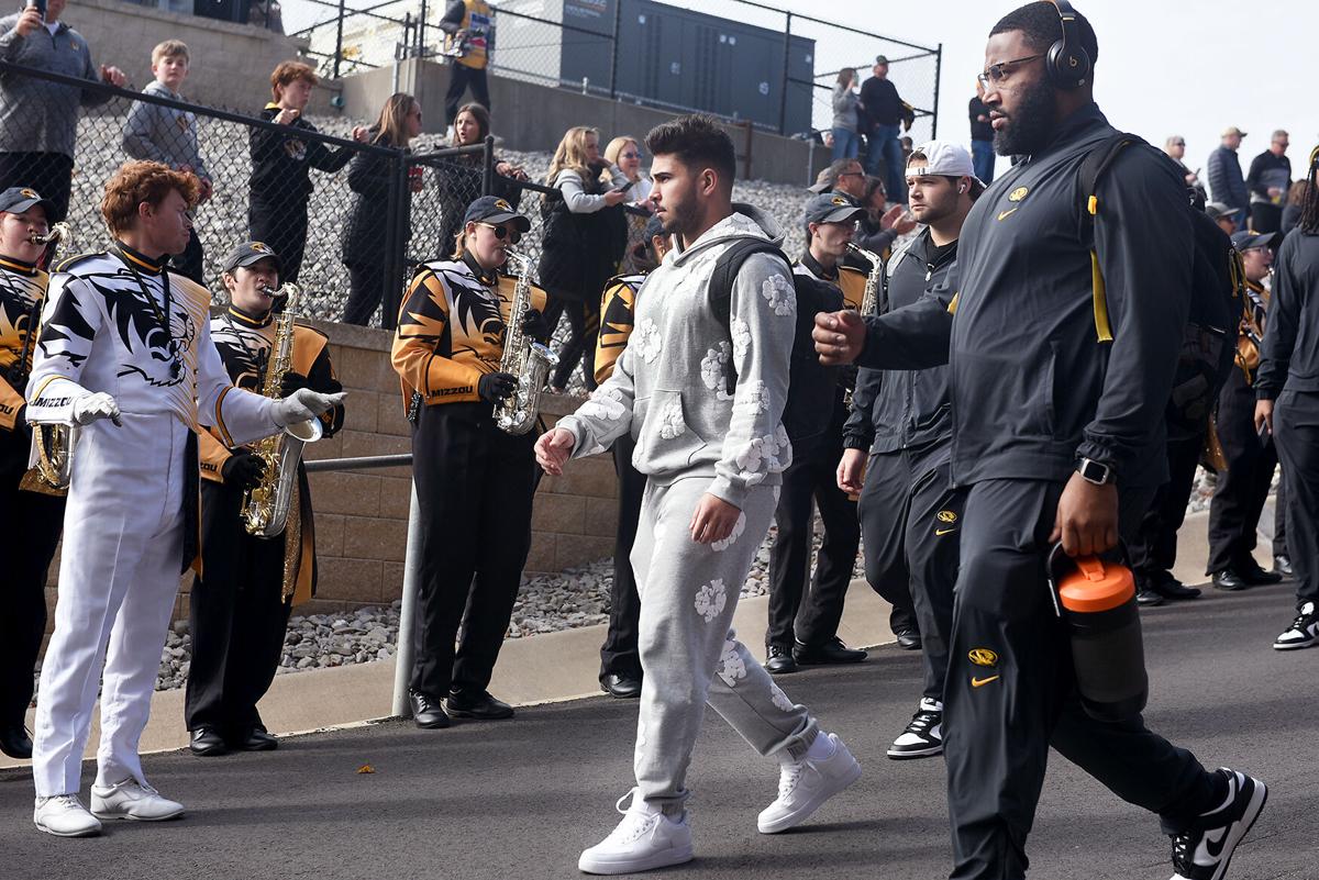Mizzou running back Cody Schrader walks in the Tiger Walk Mizzou