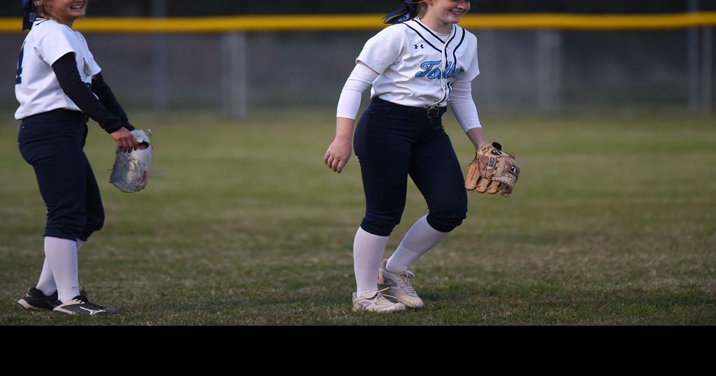 Tolton High School left fielder Mae Cross laughs with shortstop