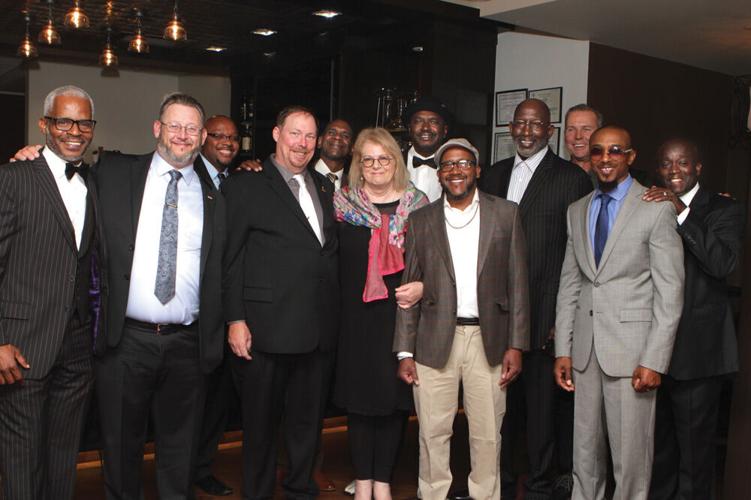 Centurion Executive Director Kate Germond with exonerees from across the country