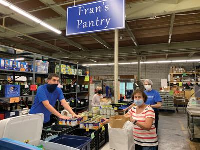 volunteers at work_food pantry_masks.jpg