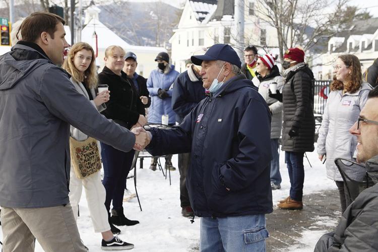 12-05-21 Pappas shaking hands