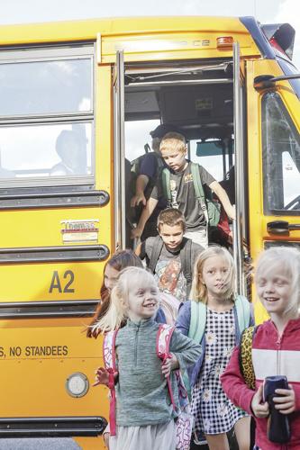 09-01-22 First Day Conway El getting off bus vertical
