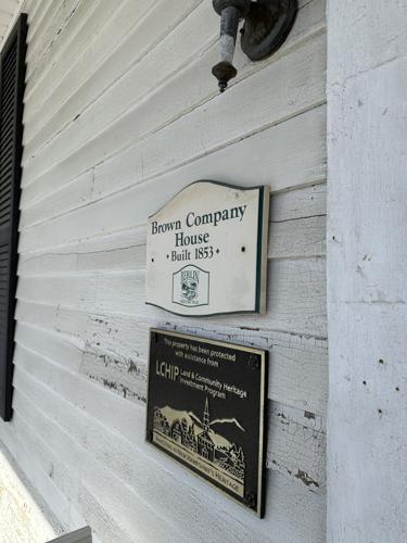 Two plaques adorn the outside of the Brown Company House