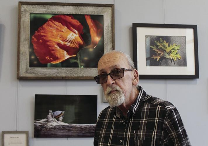 Artist Brian Bresnahan with a collection of his photos