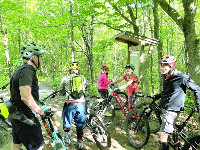Wheel Family Fun - Hurricane Mountain Zone - riders gather by the kiosk