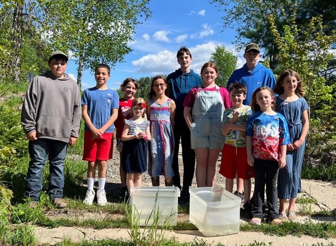 Errol Consolidated School students release trout