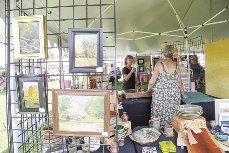 08-06-22 Art in the Park talking with customer wide