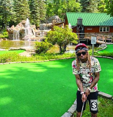Golf Column - Lil Wayne - playing mini golf