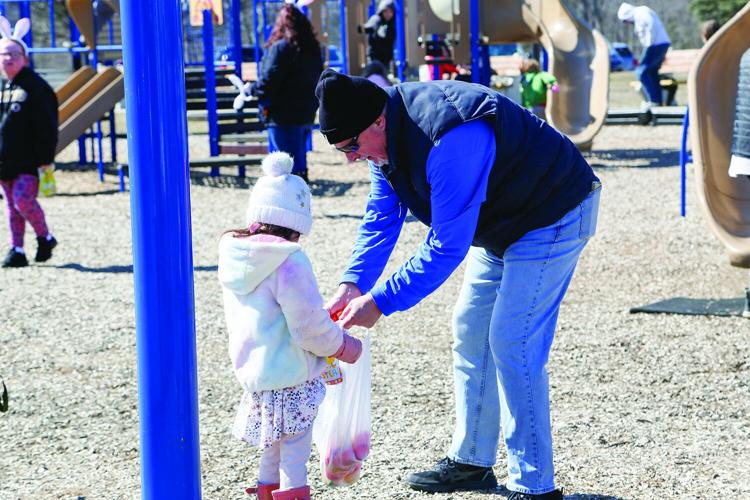 04-08-23 NCCC Egg Hunt phil handing egg