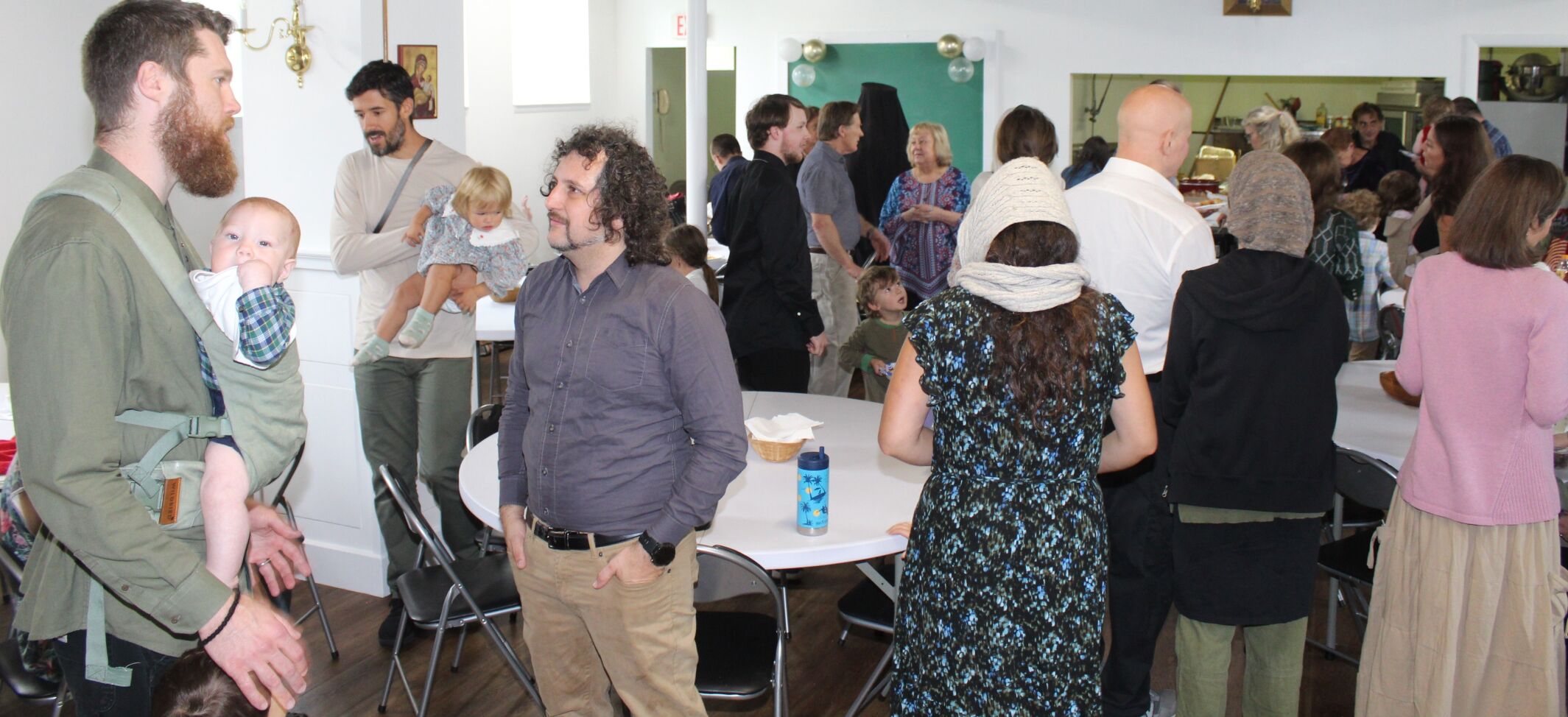 Gathering for food and fellowship inside the Russian church in Berlin