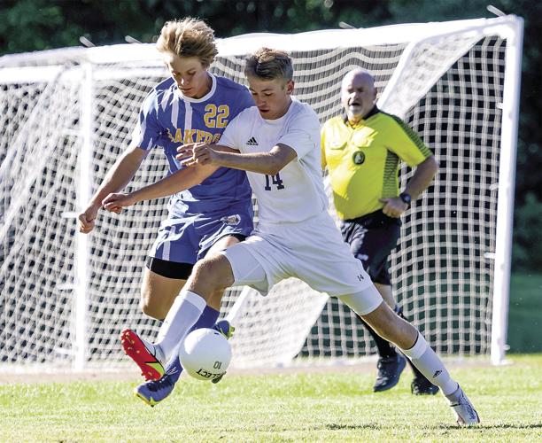 FA Boys Soccer - Will Guthro wins the ball