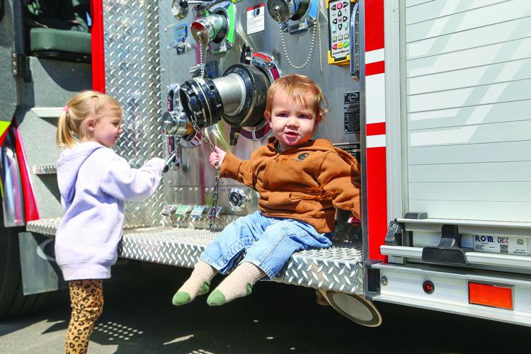 04-21-26 Touch-A-Truck siblings smile