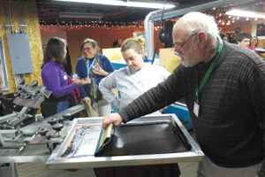Barn Door Screen Printers hosts Chamber After Hours/Attendees learn how to make T-shirts
