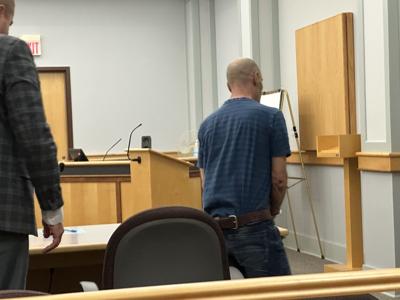 Carlos A. Dorego (right) leaves the courtroom after being sentenced on two felony convictions