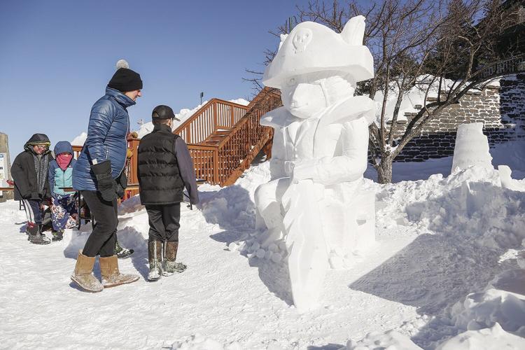 01-30-22 Snow Sculpting cat spectators