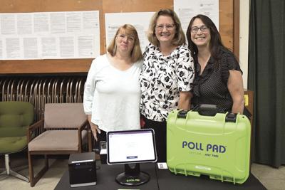 Town Clerk votimg machines - three town clerks