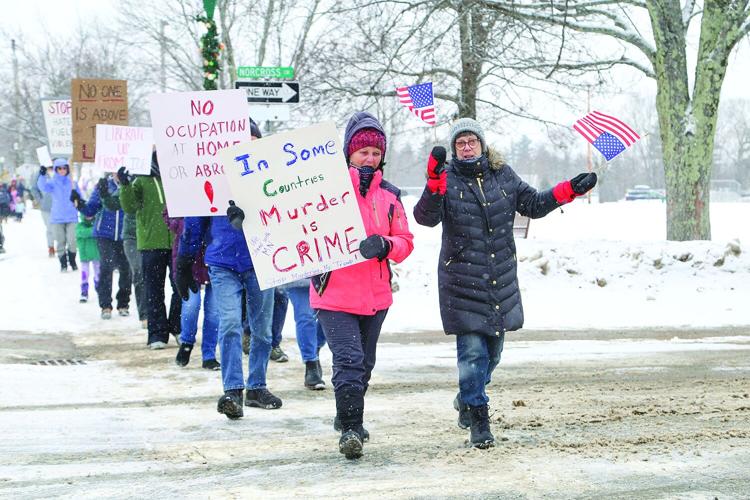 01-17-26 NoCo Protest March waving flags