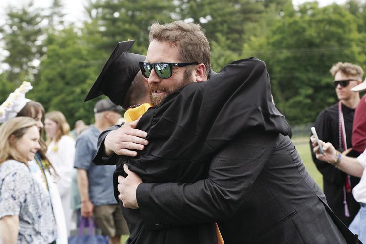 06-08-24 KHS Grad hug carpenter macpherson