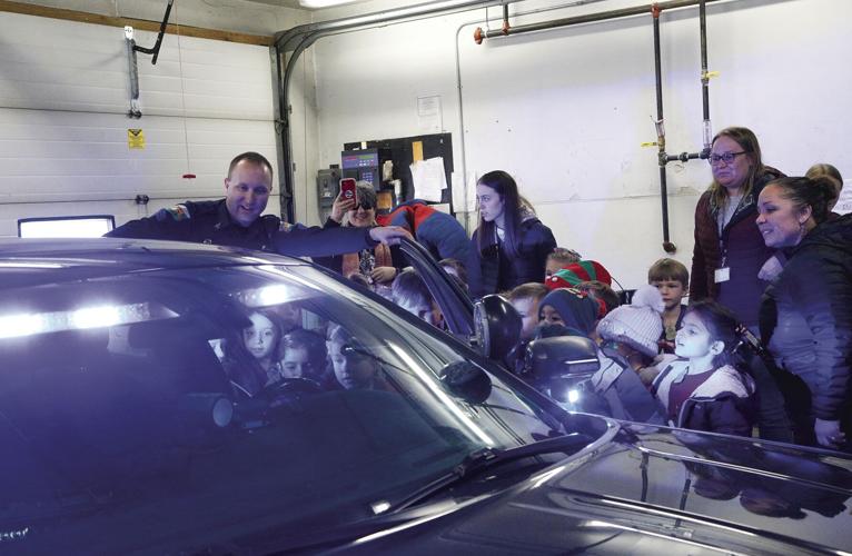 12-21-22 Gingerbread Hunt pd looking in cruiser wider