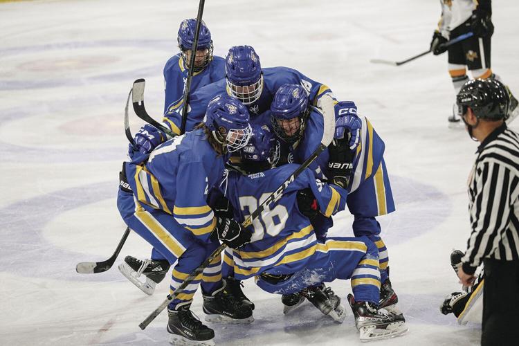 12-27-22 Peter Hall Xmas Tournament ice cats celebration after richard medium