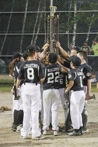 06-27-22 Cal Ripken U12 Championship hoisting trophy