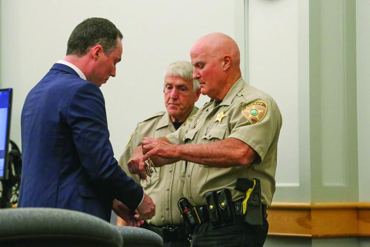 09-15-26 Badger Sentencing cuffs 1