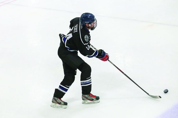 03-23-26 Battle Badges Hockey above taking in