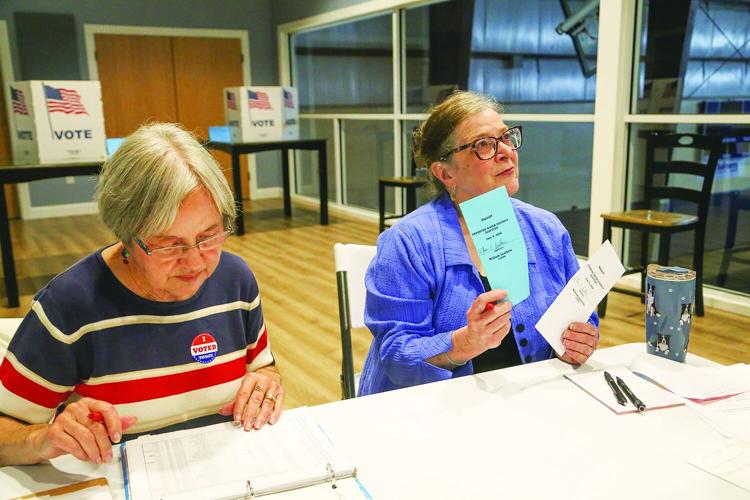 06-09-26 Fryeburg Voting water check-in pair