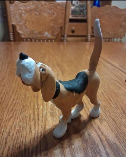 A friendly looking carving of a dog