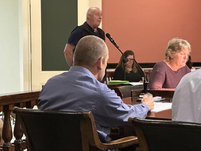 Burgess Street resident Paul Guerin speaks May 4 at the microphone