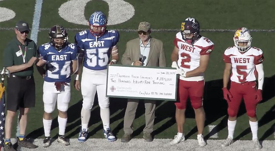 Tyler Walcott - CHaD football game - with check