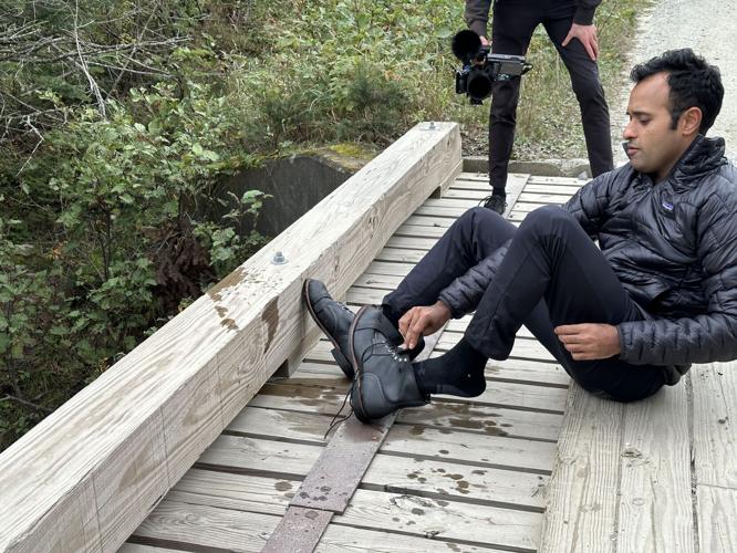 Vivek Ramaswamy drains the water from his boots