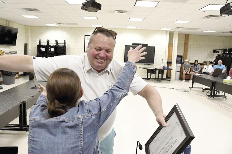 Conway School Board - retirees - Matt Liebenow hug
