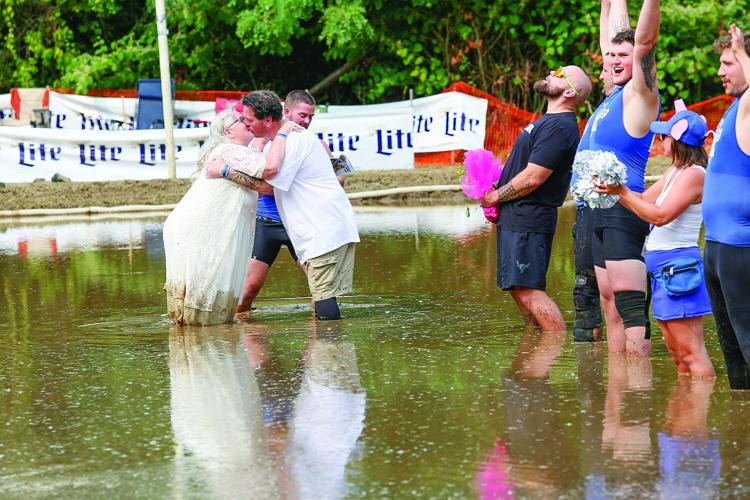 09-06-25 Mud Bowl Wedding kiss