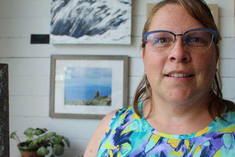 Dawn Grondin, from Bethel, Maine, stands near her photograph