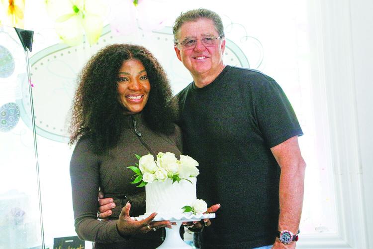 06-19-25 Danette-TV Couple pose with cake medium