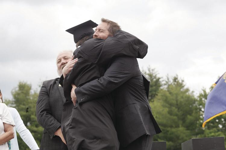 06-08-24 KHS Grad hug carpenter young 2