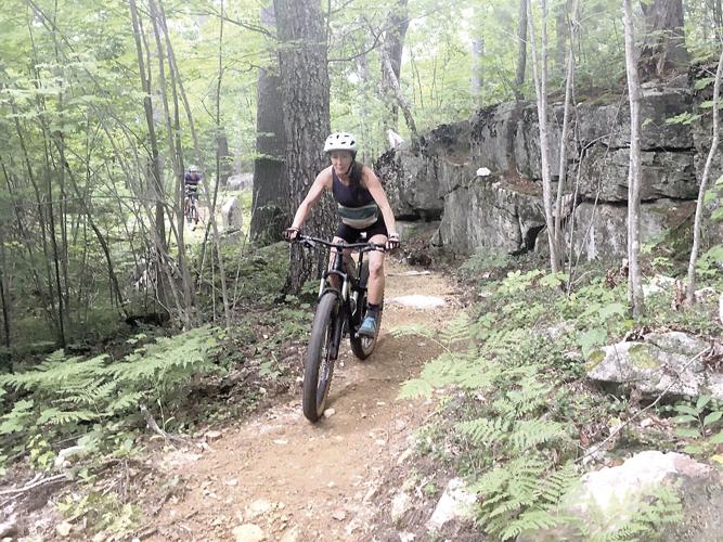 Wheel Family Fun - Carissa Milliman pedals past a rock ledge